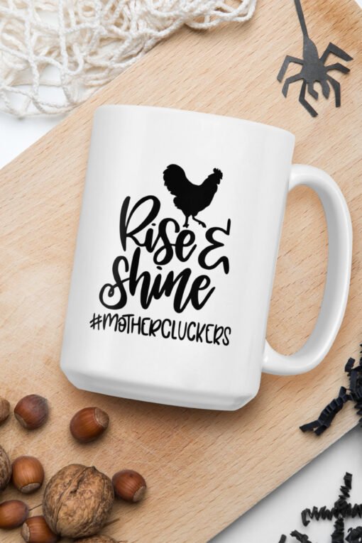 15 oz Rise and Shine Mothercluckers coffee mug – large ceramic mug featuring cheeky chicken graphic, ideal for backyard flock keepers and chicken fans.